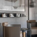 Luxe powder room with artistic sink and lighting